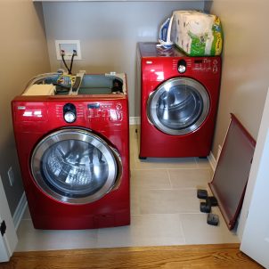 appliance repair technician fixing washer