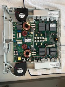 appliance technician testing faulty device