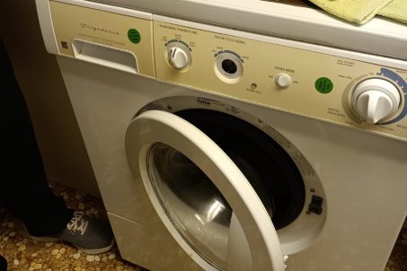front load washer with door open for repair